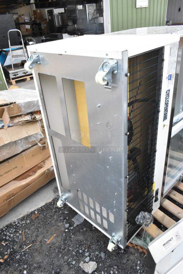 Alt text: Avantco 193BC48HCW 48" white bakery display case on side, showing glass damage and casters. 115V, 1 phase.