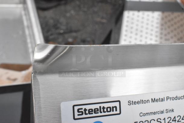 BRAND NEW SCRATCH AND DENT Steelton 522CS12424 18-gauge stainless steel commercial sink with visible corner dent.