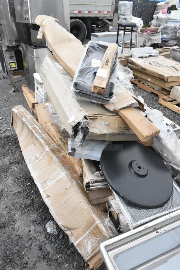 Scratch and dent auction lot with new items; includes Lancaster table base, American Metalcraft tray, and Lavex hand trucks.