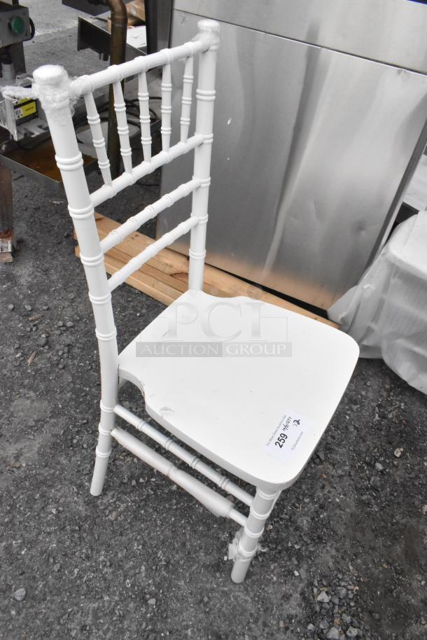 White Chiavari stackable banquet chair, brand new with scratch and dent, includes label with item number 259.