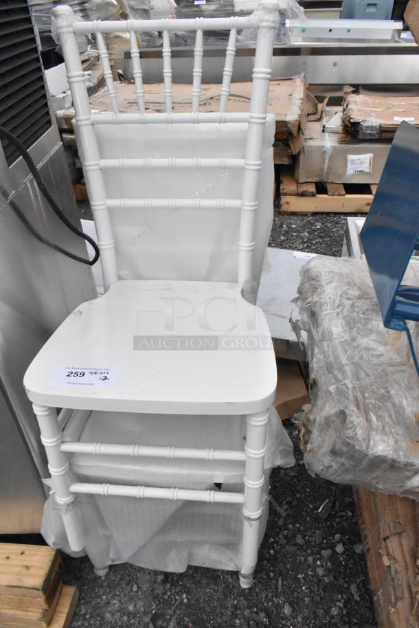 White Chiavari stackable banquet chair, new with light scratches and dents. Ideal for events. Auction tag states lot 259.