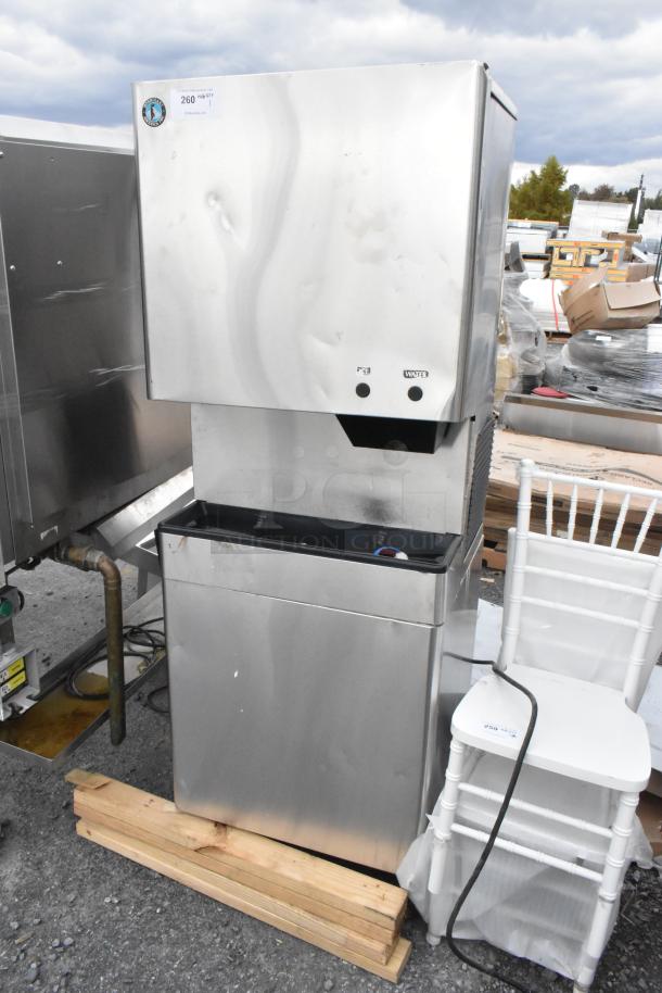 Hoshizaki DCM-500BAH ice maker and dispenser, stainless steel, on SD-500 cabinet stand. 115-120 volts, 1 phase, visible dents.