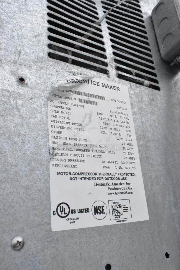 Metallic panel of Hoshizaki DCM-500BAH Ice Maker. Label shows model, voltage, and certification marks. UL, NSF, CE listed.