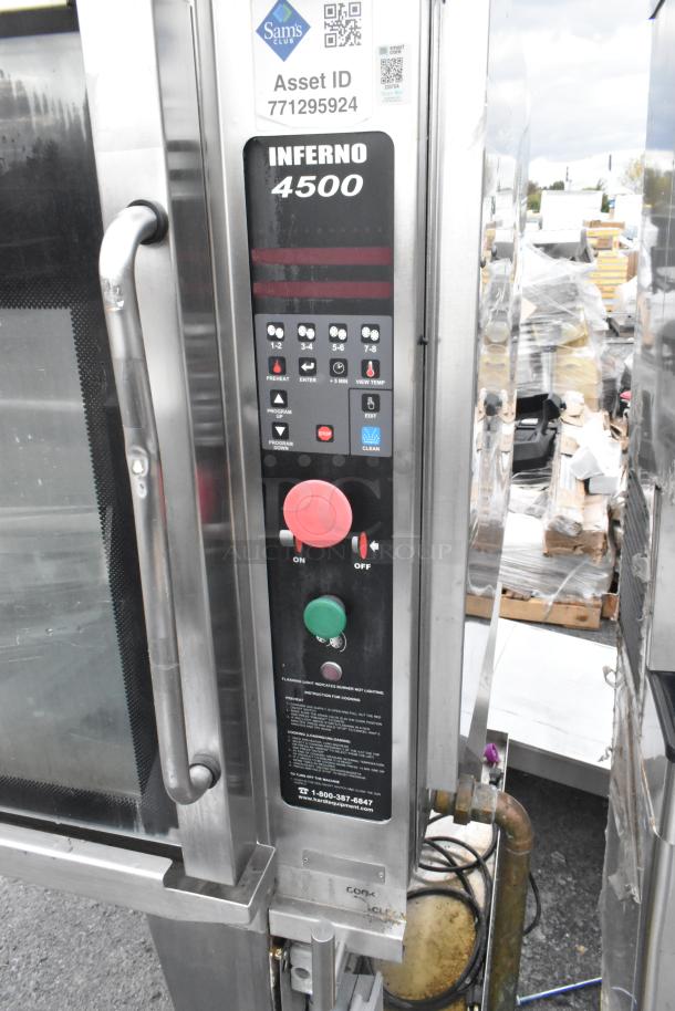 Hardt Inferno 4500 stainless steel gas rotisserie oven, features skewers, metal legs, commercial casters, and control panel.