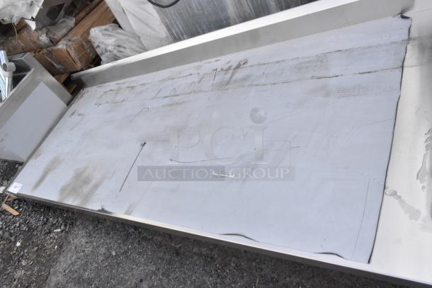 BRAND NEW SCRATCH AND DENT Regency 600ST3096R stainless steel tabletop w/ sink bay, dents visible, no legs included.