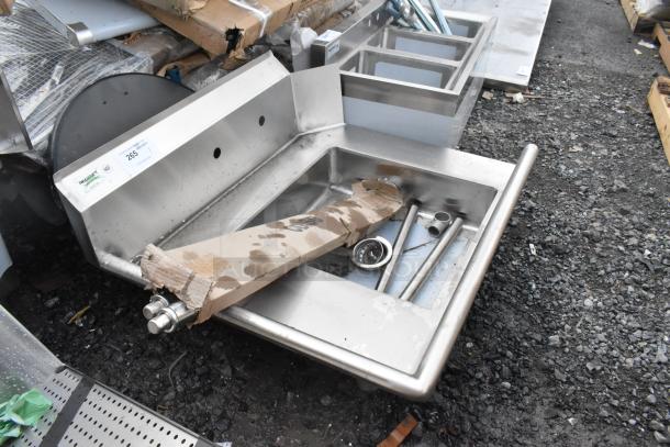 Brand new Regency 600DDT36L 3' soiled dish table, left drainboard, 16 gauge, minor scratches, includes paperwork and fixtures.