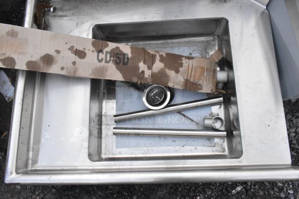 BRAND NEW SCRATCH AND DENT Regency 600DDT36L 16 gauge 3' soiled dish table with left drainboard, visible minor dents, and packaging.