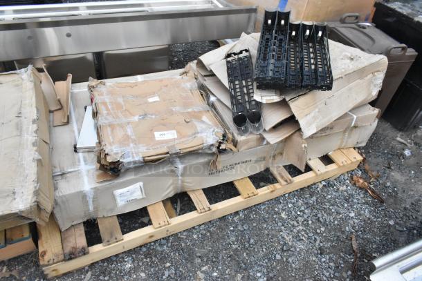 Pallet with boxed 600TSB3072S stainless steel work table, Regency 460EB3036 wire shelf, Lancaster TB3030 base, in scratch and dent condition.