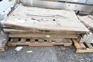 Seven brand new, scratch-and-dent Lancaster Table & Seating table tops on pallets; includes models 3493048BBESP, 427SD3636FH, and 1643048TFRMH.