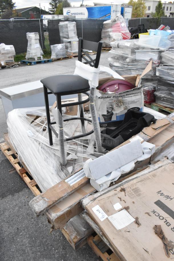 Pallet of various brand new scratch and dent items including shelving post, table base, chair, and flatware retriever box.