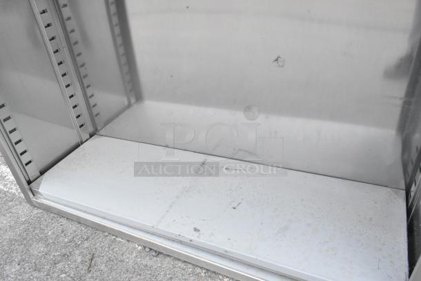 BRAND NEW Regency 600DC1548 dish cabinet, 18-gauge Type 304 stainless steel, includes adjustable midshelf, slight blemishes.