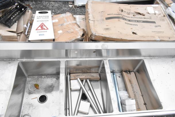 BRAND NEW SCRATCH AND DENT Regency 600S31824224 3 bay stainless steel sink with dual drain boards, slight cosmetic damage.