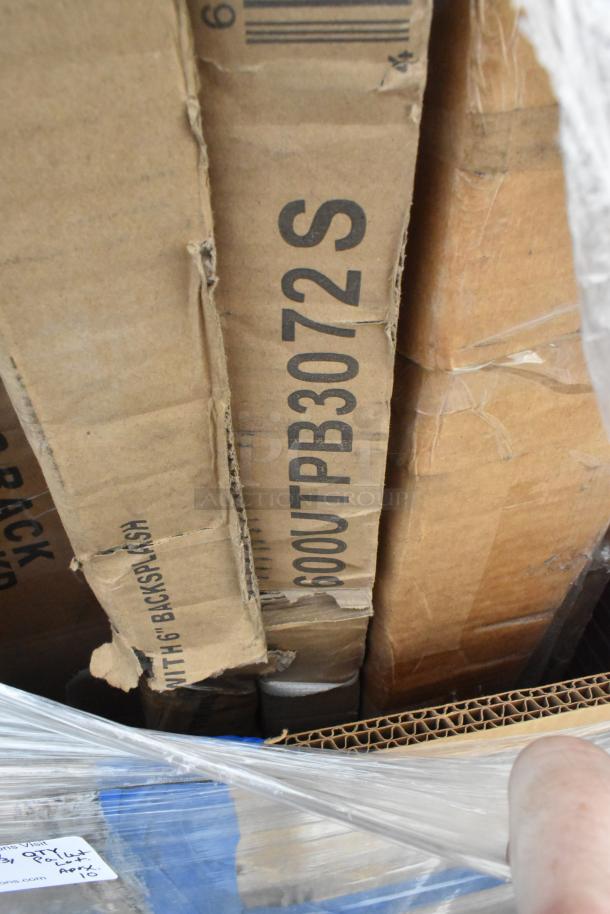 10 brand new Regency work tables in scratch and dent condition, packaged in original boxes, wrapped with plastic.