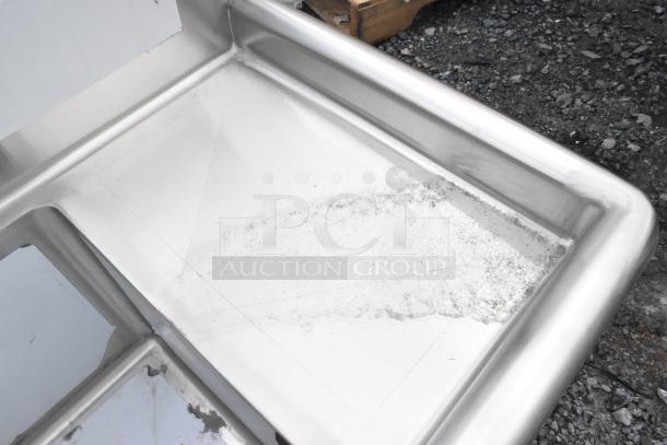 Brand new Steelton 522CS31014LR 54" stainless steel three-compartment sink, 18-gauge, with 2 drainboards. Scratch and dent, no legs.