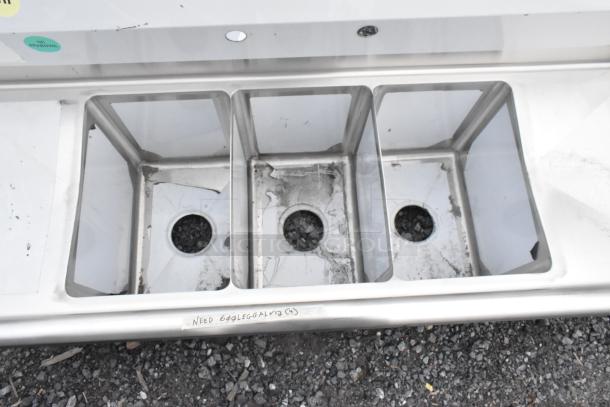 BRAND NEW SCRATCH AND DENT! Steelton 54" stainless steel sink, 3 compartments, 2 drainboards, no legs, visible wear.