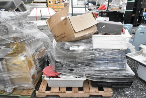 Lot of assorted items including metal fry baskets, poly bins, and bowls wrapped in plastic on a pallet. Box labeled "American Specialties, Inc."