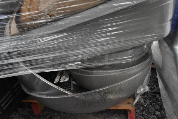 Lot of kitchen items including metal fry baskets, poly bins, and bowls wrapped in plastic, used condition.