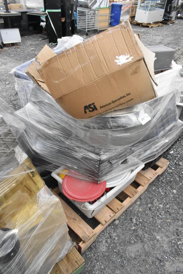 Lot of items wrapped on pallet including metal fry baskets, poly bins, and bowls. Cardboard box labeled "American Specialties, Inc." in fair condition.