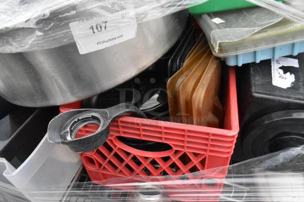 Lot of items including poly bins, lids, wire shelves, metal containers; various conditions; auction label visible.