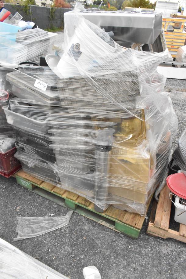 Bulk pallet of mixed items including poly bins, lids, wire shelves, and metal containers. Items are shrink-wrapped for sale.