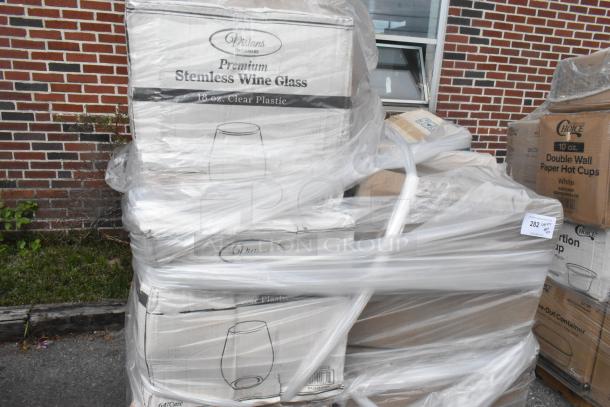 Paletted stack of boxed Visions 18 oz. clear plastic stemless wine glasses, wrapped in plastic for auction.