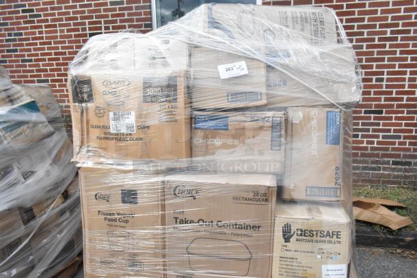 Shrink-wrapped pallet of assorted new items including Choice take-out containers, polka dot paper cups, and BestSafe nitrile gloves.