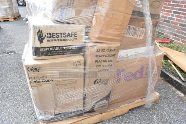 Pallet of boxed disposable items including Choice and BestSafe brands, sealed in plastic wrap.