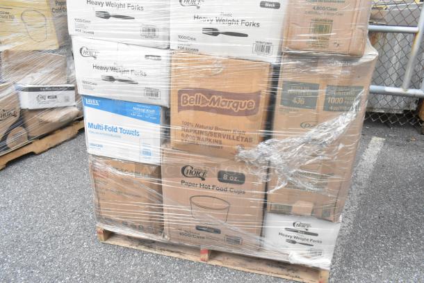Pallet of bulk boxes including Bell Marque napkins, Choice plastic forks, and Lavex towels, wrapped in plastic.