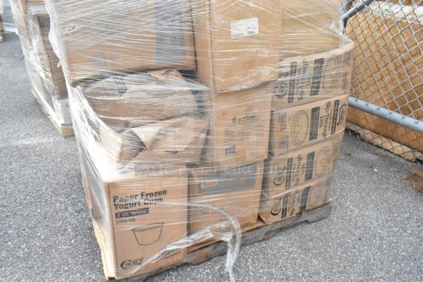 A pallet wrapped in plastic containing boxes of paper frozen yogurt cups, hot cups, and paper bags, labeled "scratch and dent."