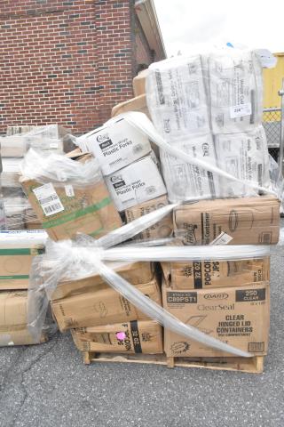 Pallet of 23 new scratch and dent items, including cold cups and plastic cutlery, in original packaging. Various brands visible.