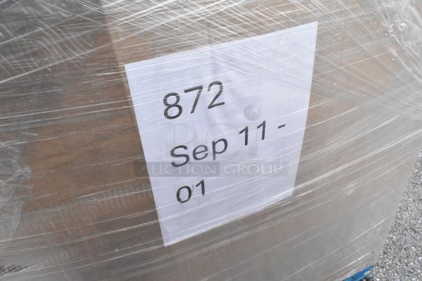 Plastic-wrapped pallet labeled "872 Sep 11-01," containing 25 new scratch and dent items including stainless steel Speedwell, wire shelf.
