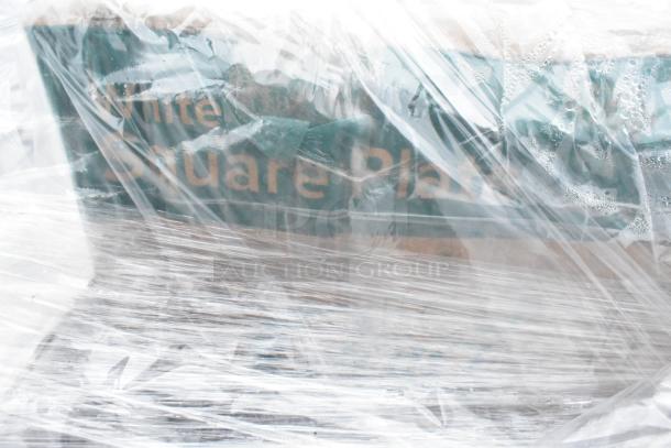 A pallet of 25 new scratch and dent items wrapped in plastic, including a stainless steel double Speedwell and wire shelf.