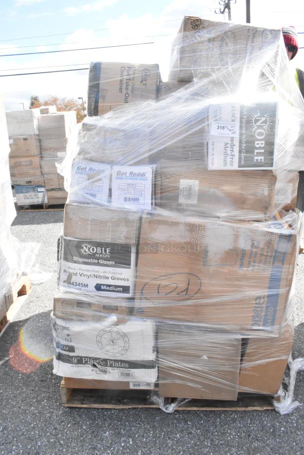 Pallet of scratch and dent items including Noble gloves, food storage bags, and plates in original packaging, wrapped in plastic.