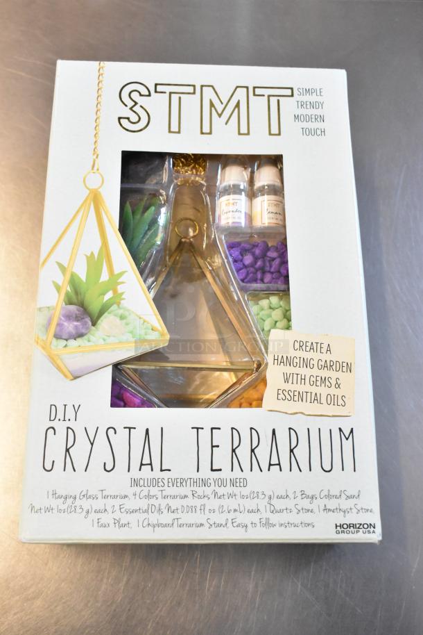 STMT DIY Crystal Terrarium kit includes glass terrarium, rocks, essential oils, and instructions. Brand: Horizon Group USA.