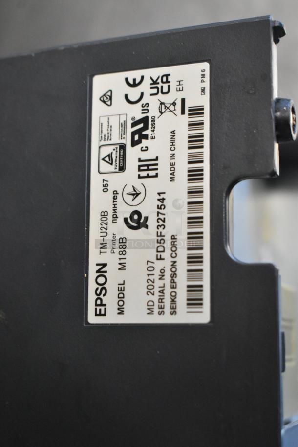 Epson receipt printer, model M188B, close-up of label showing certifications and serial number FD5F327541.