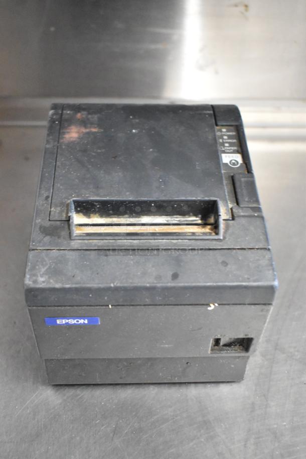 6 Epson receipt printers, models including M129C, M188B, TM-T20II, visibly worn, branded label, multiple bid opportunity.