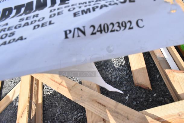 Lot of shelving pieces, brand new with scratches and dents, includes 24"x75" door, part number 2402392 C visible.