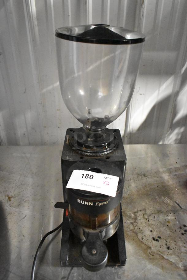 Bunn metal commercial espresso bean grinder, countertop model. 115 volts, 1 phase. Includes hopper. Auction tag number 180 visible.
