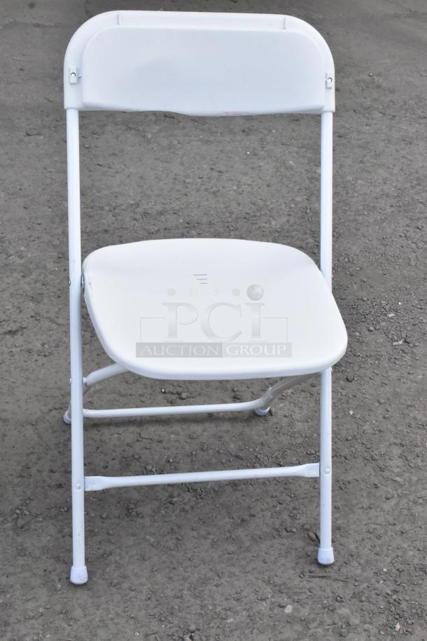 White folding banquet chair, metal frame, plastic seat. Condition: used. Auction lot includes 90 similar chairs.