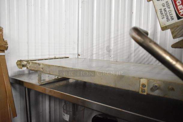 Rondo Seewer 50339 metal commercial dough sheeter on bench; reversible function; visible wear; 208/240 volts.