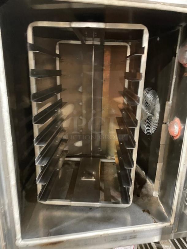 Baxter OV300G stainless steel convection oven with 8-pan rotating rack, digital controls, open-base pan holder, on casters.