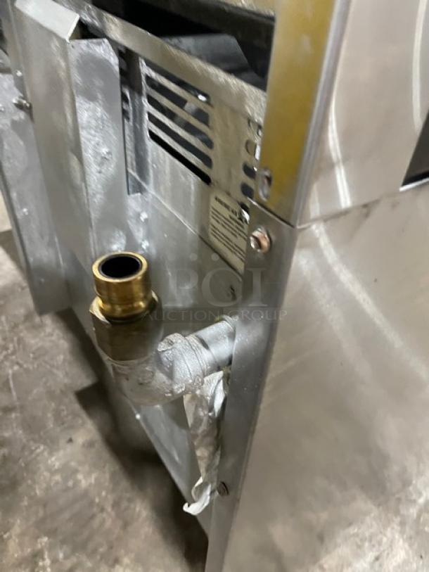 American Range stainless steel natural gas connector, showing side and gas inlet. Commercial-grade durability and quality.
