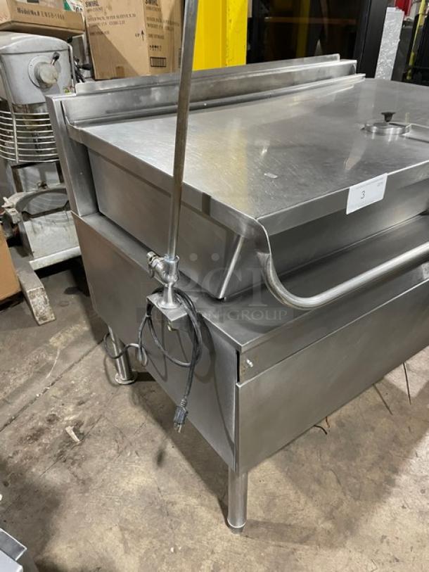 Cleveland Range stainless steel electric tilt braising pan with single spout swing faucet, on legs, in used condition.