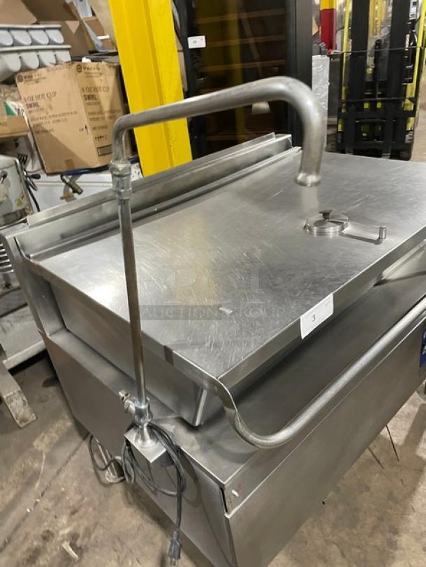 Cleveland Range stainless steel electric tilted braising pan, single spout swing faucet, on legs, used condition.