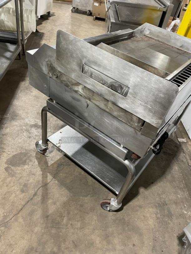 WoodStone stainless steel griddle with backsplash, undershelf cart, natural gas powered, on casters, SN: GP1B16MAY1704992.