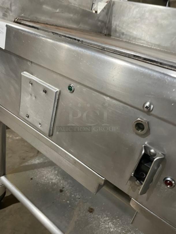 WoodStone stainless steel natural gas countertop plancha griddle with back & side splash, undershelf equipment cart, on casters.