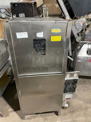 Jackson Commercial Stainless Steel Electric Door-Type Automatic Dishwasher on legs, featuring control gauges and visible labels.