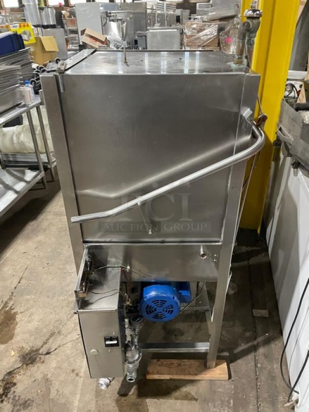 Jackson commercial stainless steel electric door-type automatic dishwasher on legs, visible motor, used condition.
