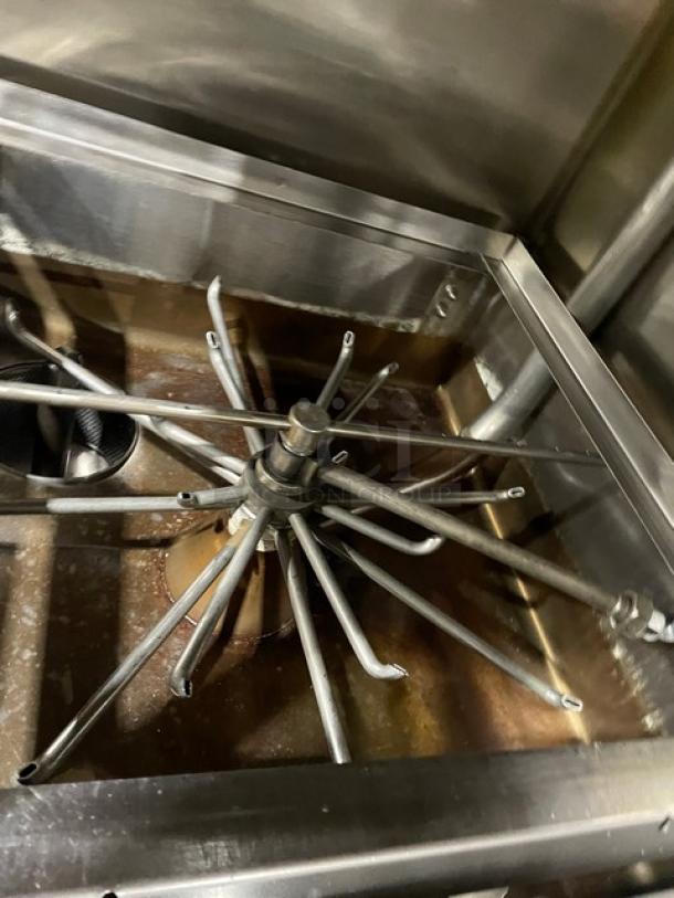 Jackson Commercial Stainless Steel Electric Door-Type Dishwasher, showing interior spray arms, on legs, used condition.