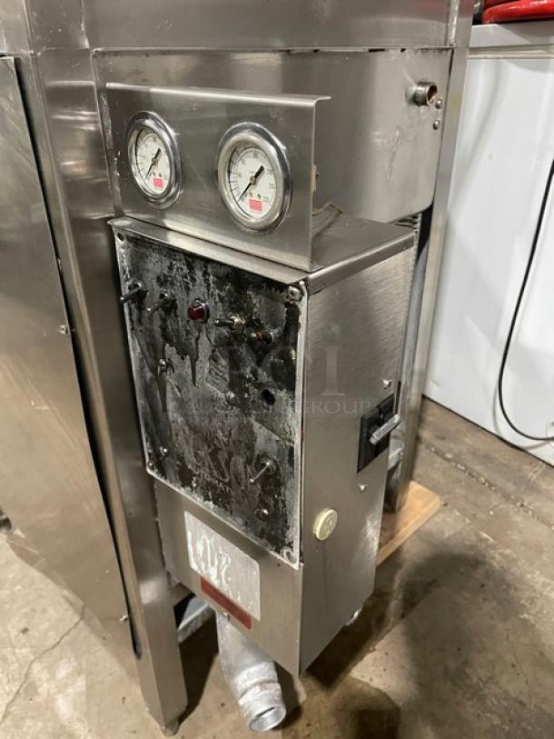 Jackson Commercial stainless steel electric door-type automatic dishwasher; features dual gauges and control panel on legs.